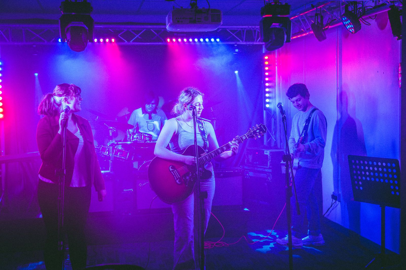 Lincoln students at End of Year showcase for music, performing on stage as a band